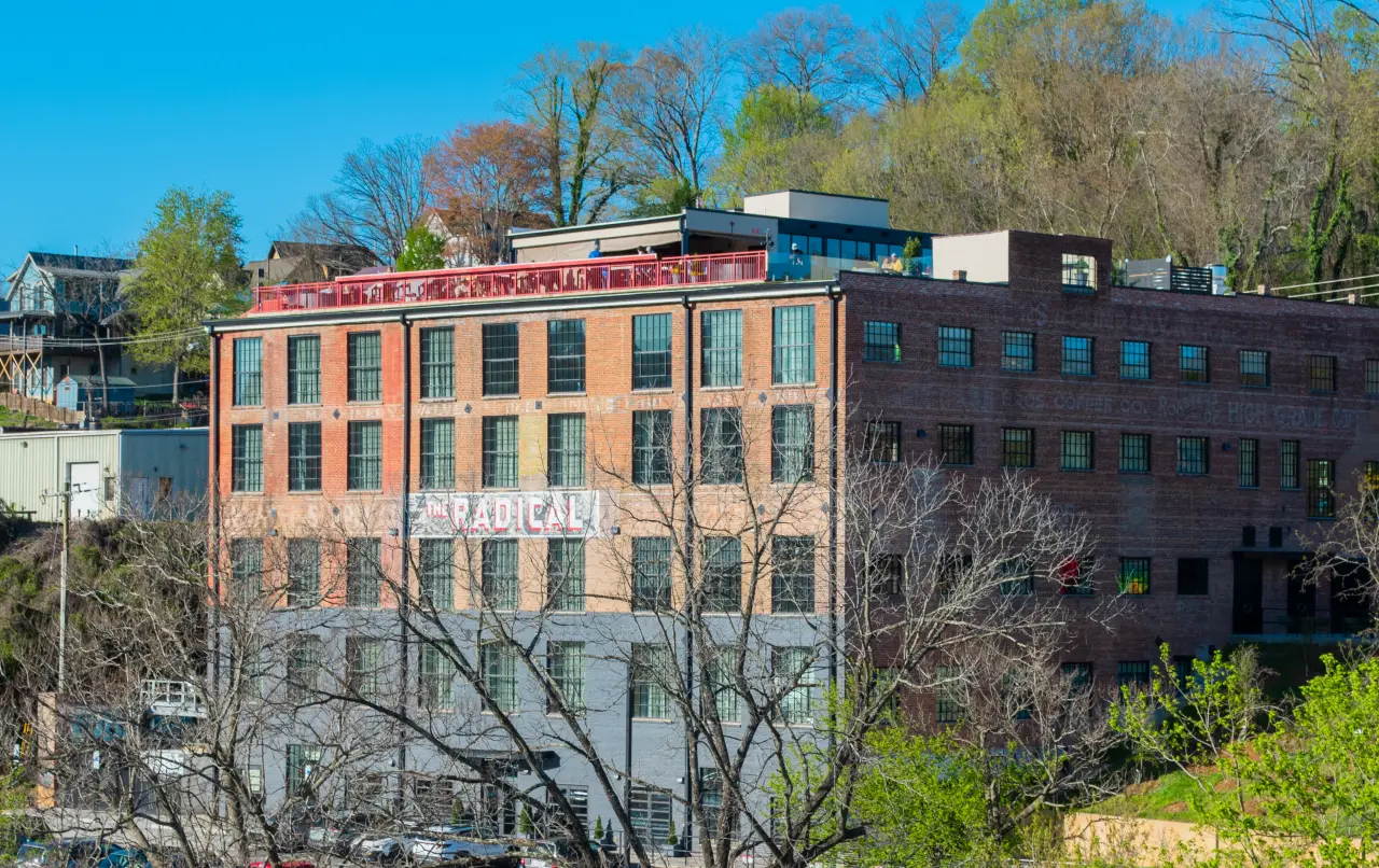 external view of The Radical Hotel, a boutique hotel and living art installation in Asheville’s River Arts District