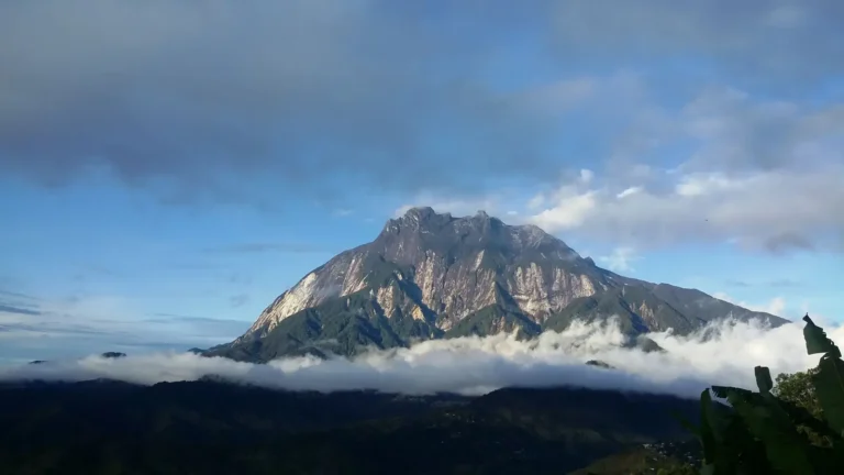Mount Kinabalu rising above the clouds in Sabah, Malaysia