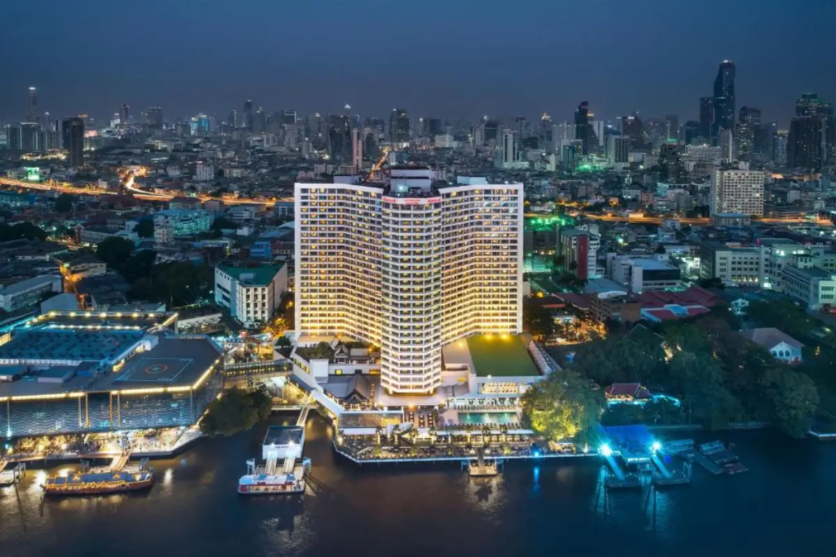 Royal Orchid Sheraton Riverside Hotel Bangkok Ranked Among Top Meeting Hotels In Asia Pacific 14 Royal Orchid Sheraton Riverside Hotel Bangkok illuminated at night with Chao Phraya River and Bangkok skyline in the background