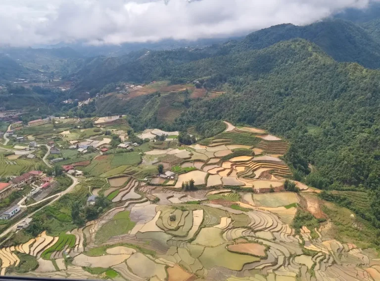 Aerial view of rice terraces and villages in the mountains of Sapa, Northern Vietnam.