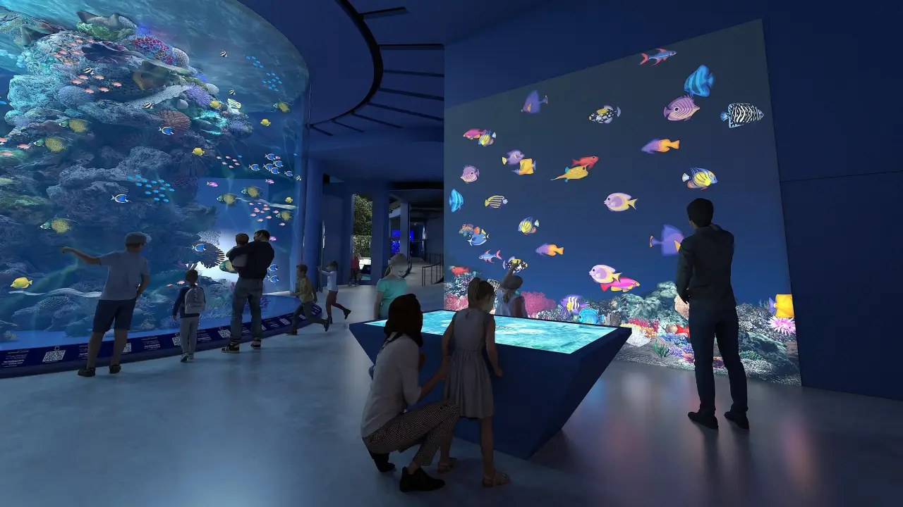 The New Singapore Oceanarium Opens, Connects Visitors To Marina Conservation 6 Families explore a vibrant coral reef exhibit and interact with digital marine displays at the Singapore Oceanarium’s immersive viewing gallery.