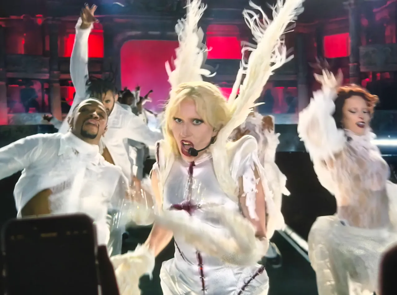 Billboard Ranks Lady Gaga As No. 4 Globally For Concert Revenue In May 5 Lady Gaga performing on stage in Singapore with dancers in dramatic white costumes