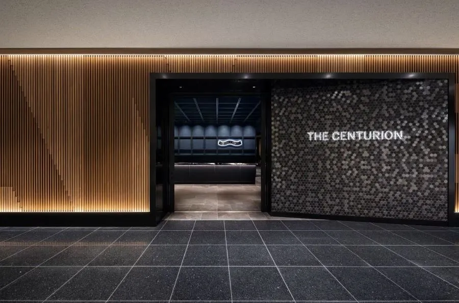 American Express Opens New Centurion Lounge At Tokyo’s Haneda Airport 3 Entrance to The Centurion Lounge at Tokyo’s Haneda Airport with illuminated signage and wood-panel wall design.