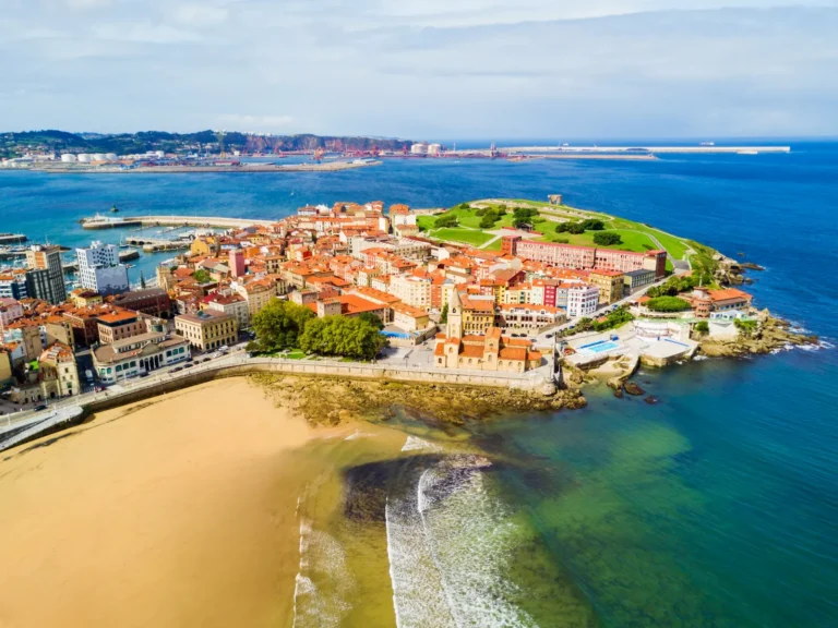 Aerial view of Gijón’s historic quarter and sandy beach on the Bay of Biscay in Asturias, Spain.