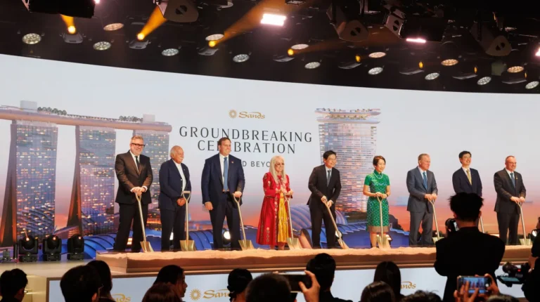 Luxury Travel 18 Dignitaries with golden shovels at Marina Bay Sands groundbreaking ceremony in front of stage display