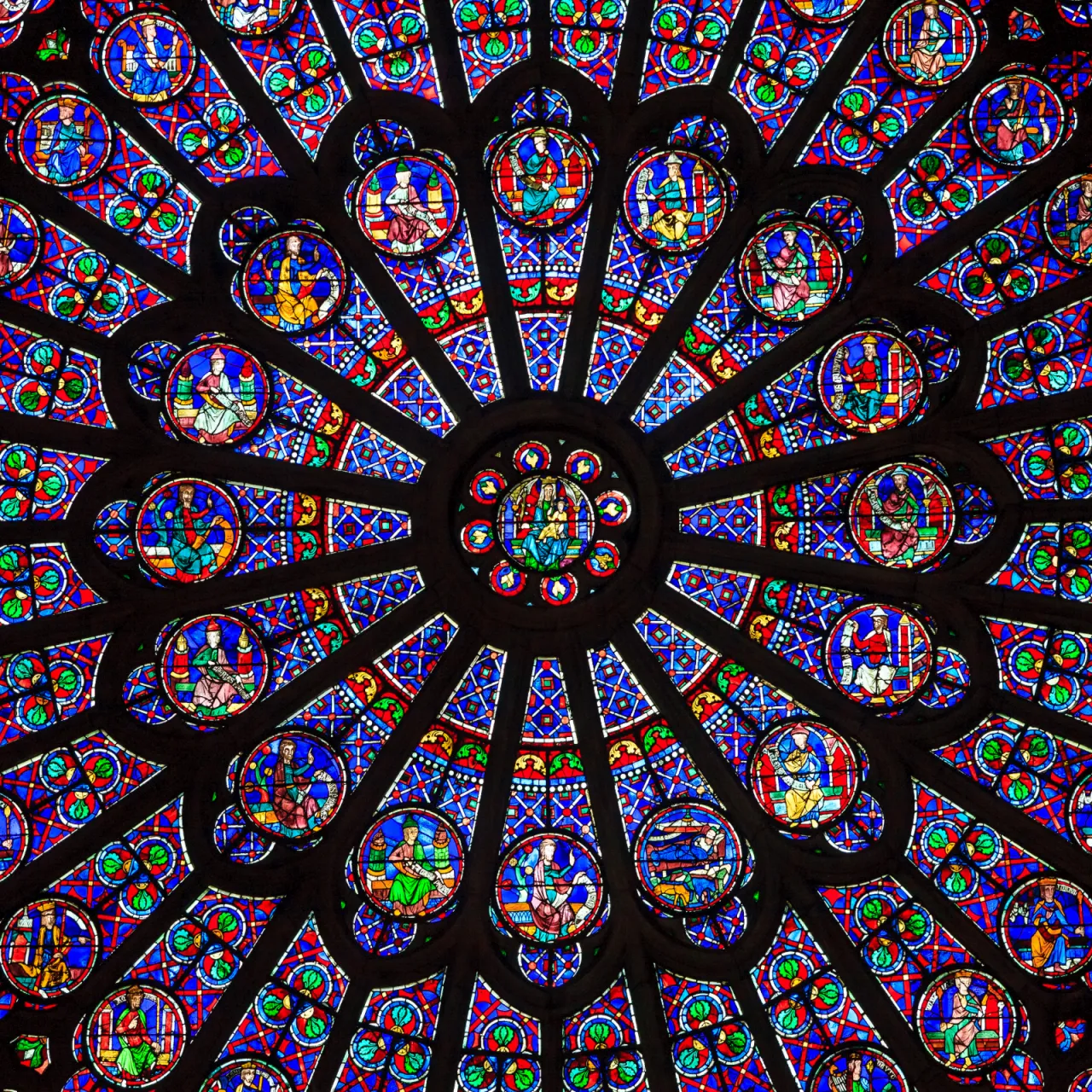 How To Do Paris In A Weekend 3 The North Rose Window at Notre Dame Cathedral with intricate Old Testament stained glass.