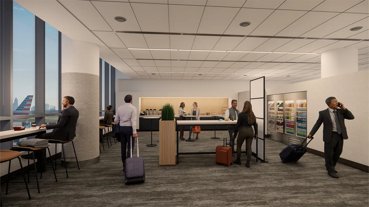 American Airlines Opens Provisions By Admirals Club Lounge At Clt 2 Travelers in the Provisions by Admirals Club lounge at CLT, featuring seating with airport views, a self-serve food area, and modern design.