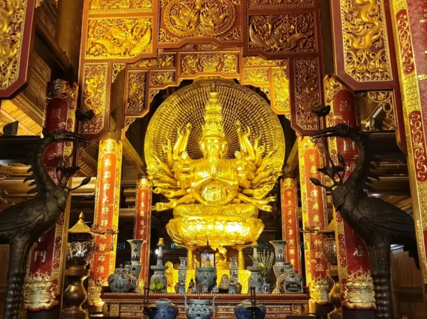 Home 24 Golden Guan Yin statue with multiple arms inside Bai Dinh Pagoda, Vietnam