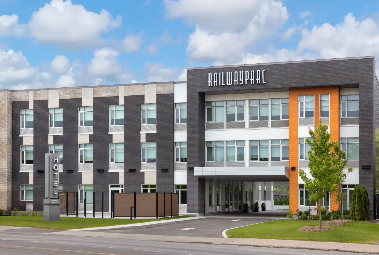Exterior of Hotel Railwayparc Montreal, a Tapestry Collection by Hilton property, showcasing modern design and signage.