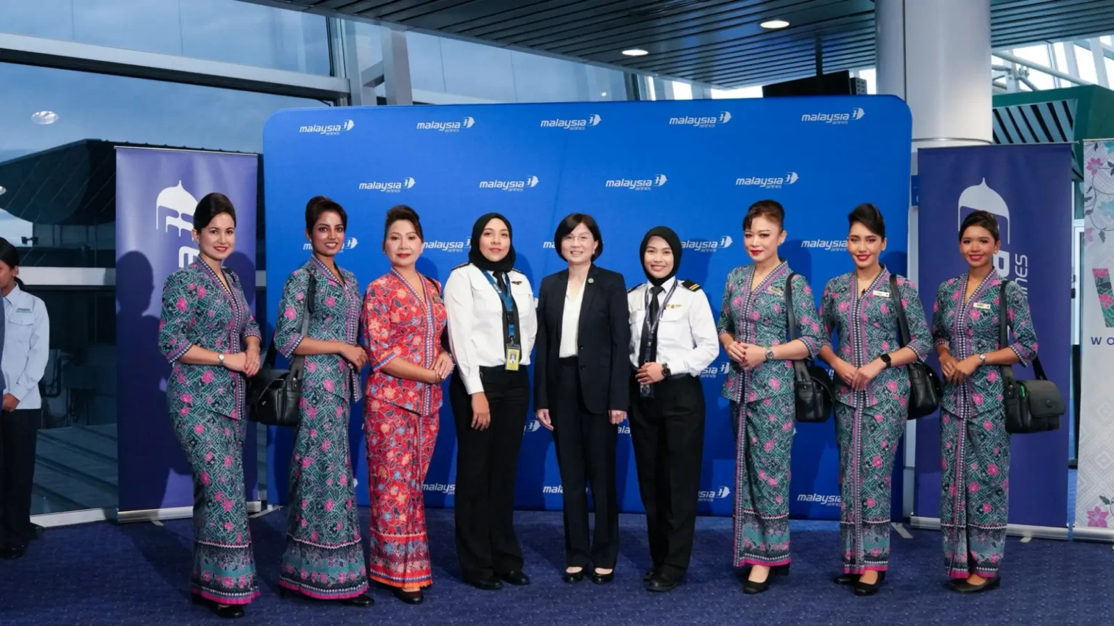 Malaysia Airlines Launches New Routes, Boosts Connectivity And Celebrates An All-Female Powered Flight 16 Malaysia Airlines all-female crew posing together at an event backdrop