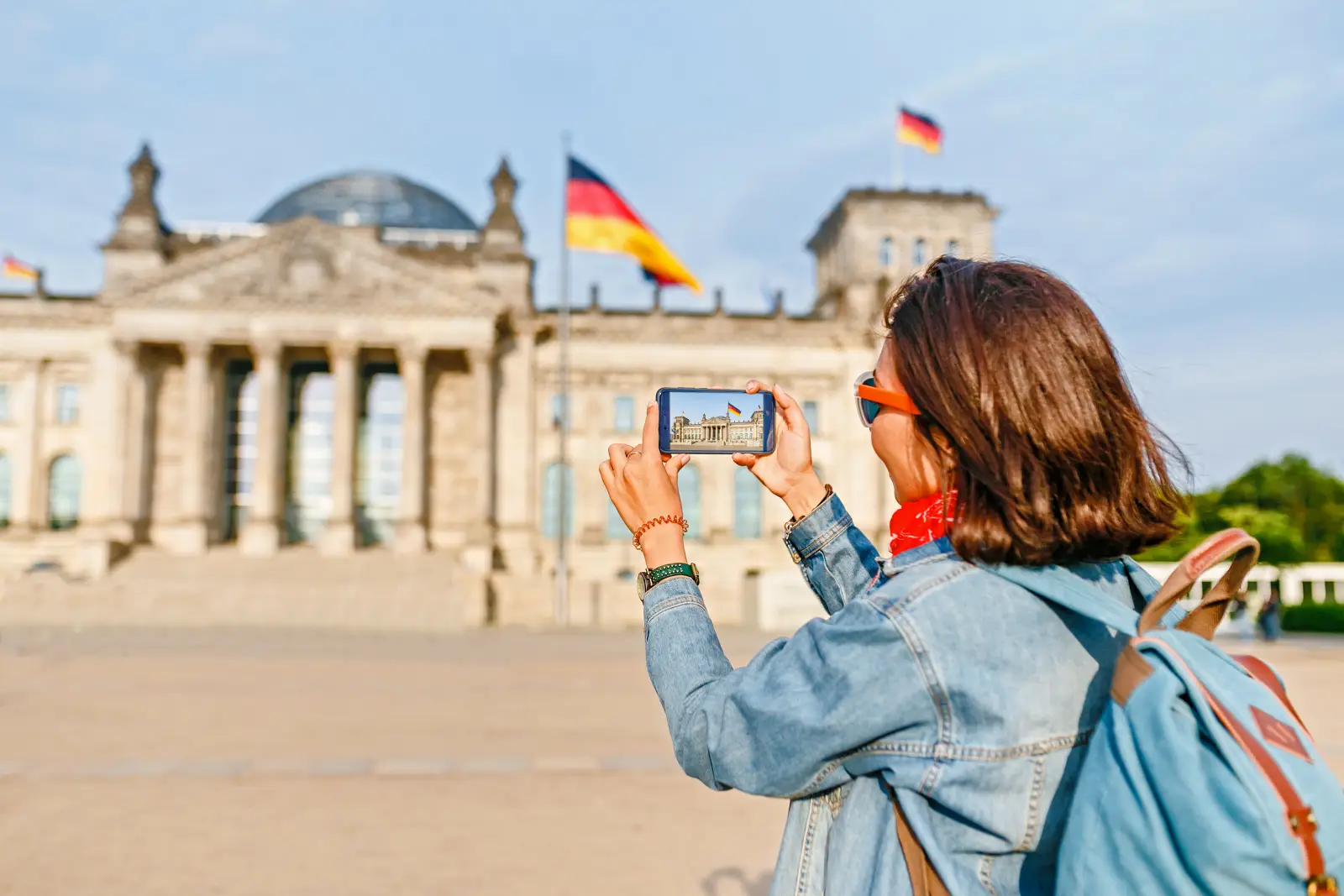 Tourist photographing the Reichstag building in Berlin, Germany