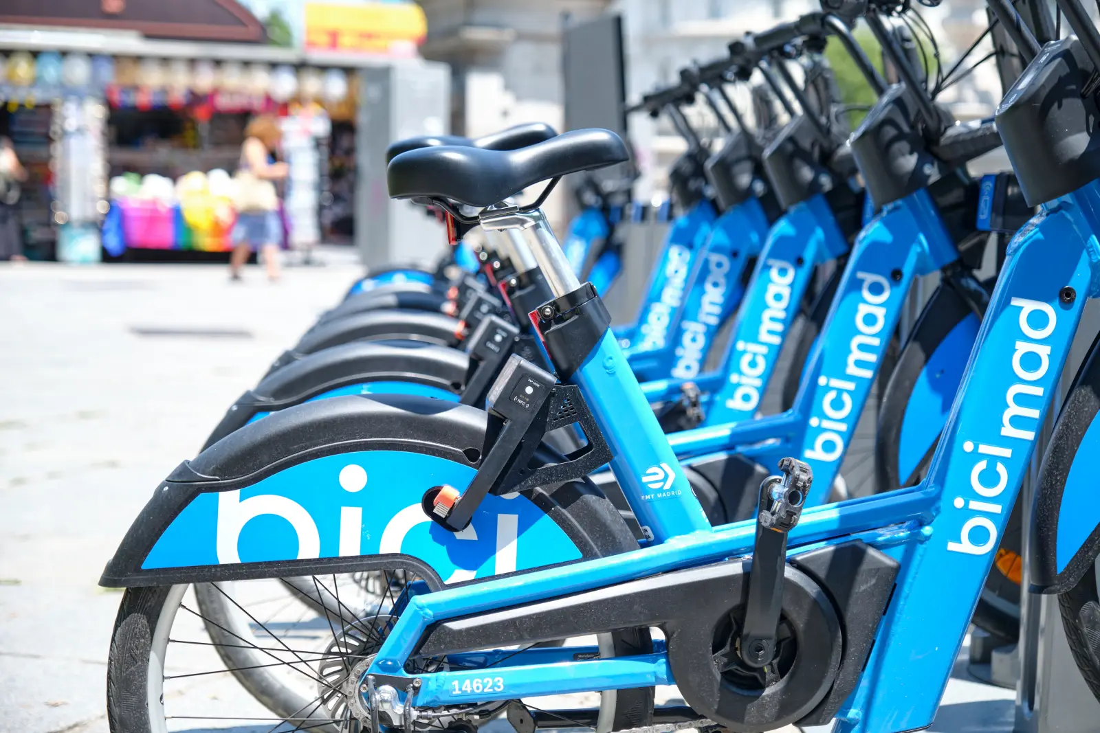 Madrid Bicycle-Sharing Program Hits All-Time High In 2025 1 Row of Bicimad public bicycles parked at a docking station in Madrid city center.