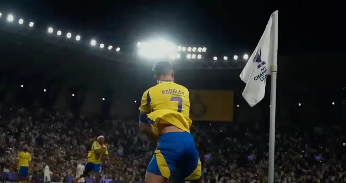 Cristiano Ronaldo Stars In Saudi Arabia’s New Global Tourism Campaign 2 Cristiano Ronaldo celebrates near the corner flag during a football match in Saudi Arabia, wearing his Al Nassr jersey.