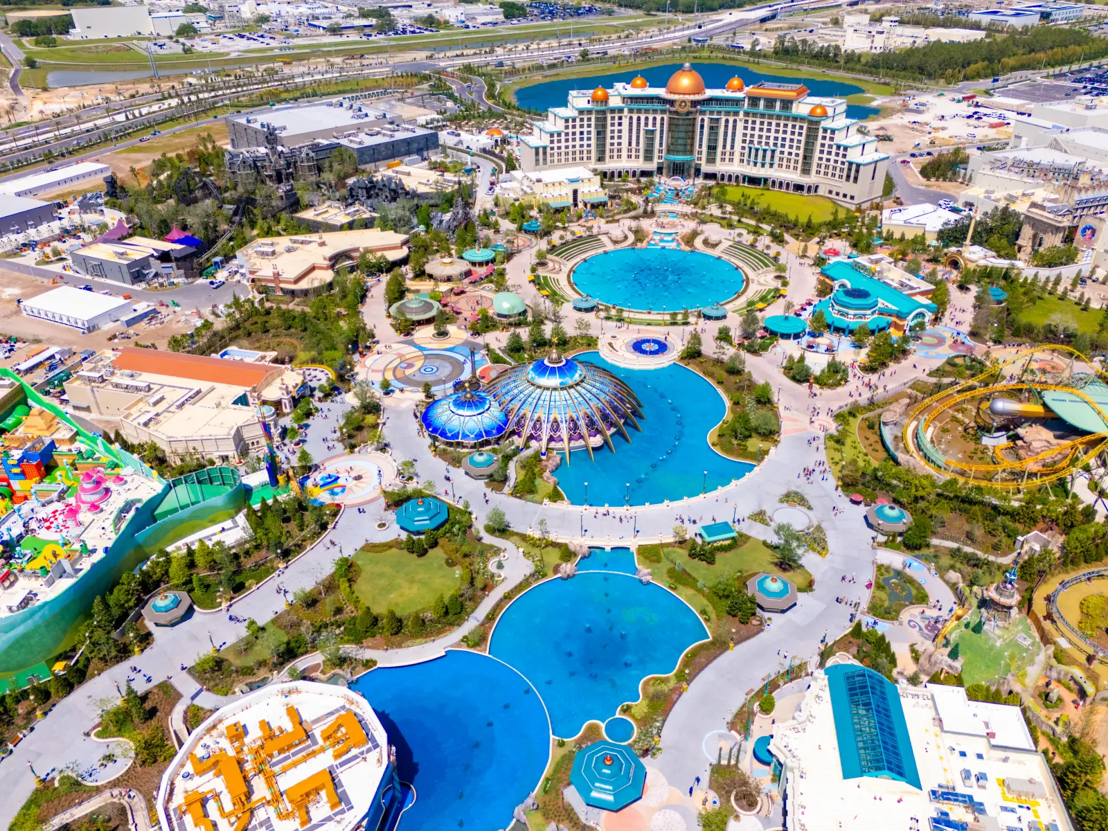 Man Dies After Riding Roller Coaster At Universal’s Epic Universe In Florida 7 Aerial view of Universal’s Epic Universe theme park in Orlando under construction with attractions, hotel, and pools.