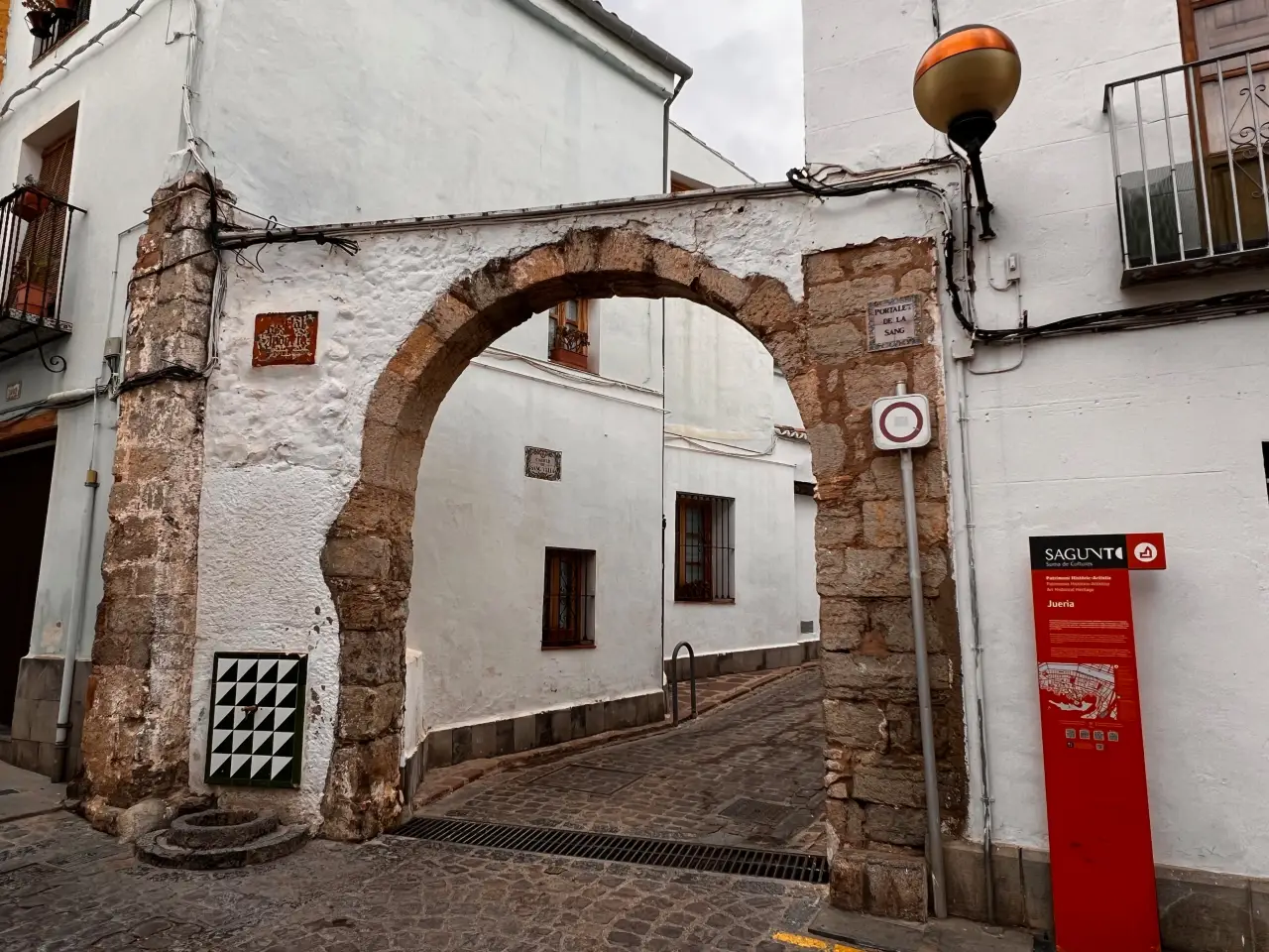 Stone arch entrance to the historic Jewish quarter in Sagunto, Valencia region, Spain