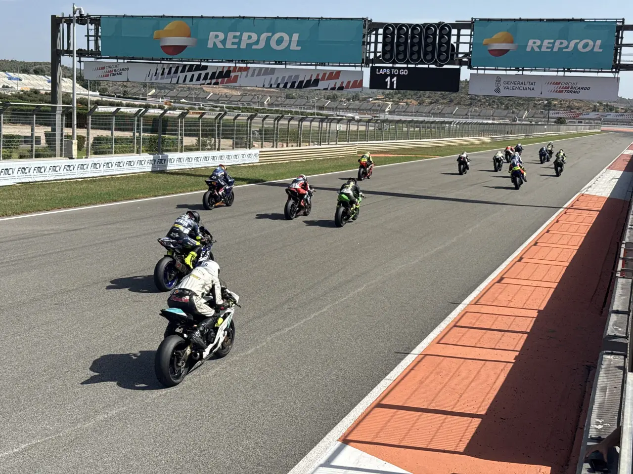 Motorcycle racers accelerate from the starting line at Circuit Ricardo Tormo during the CEF InterOpen.