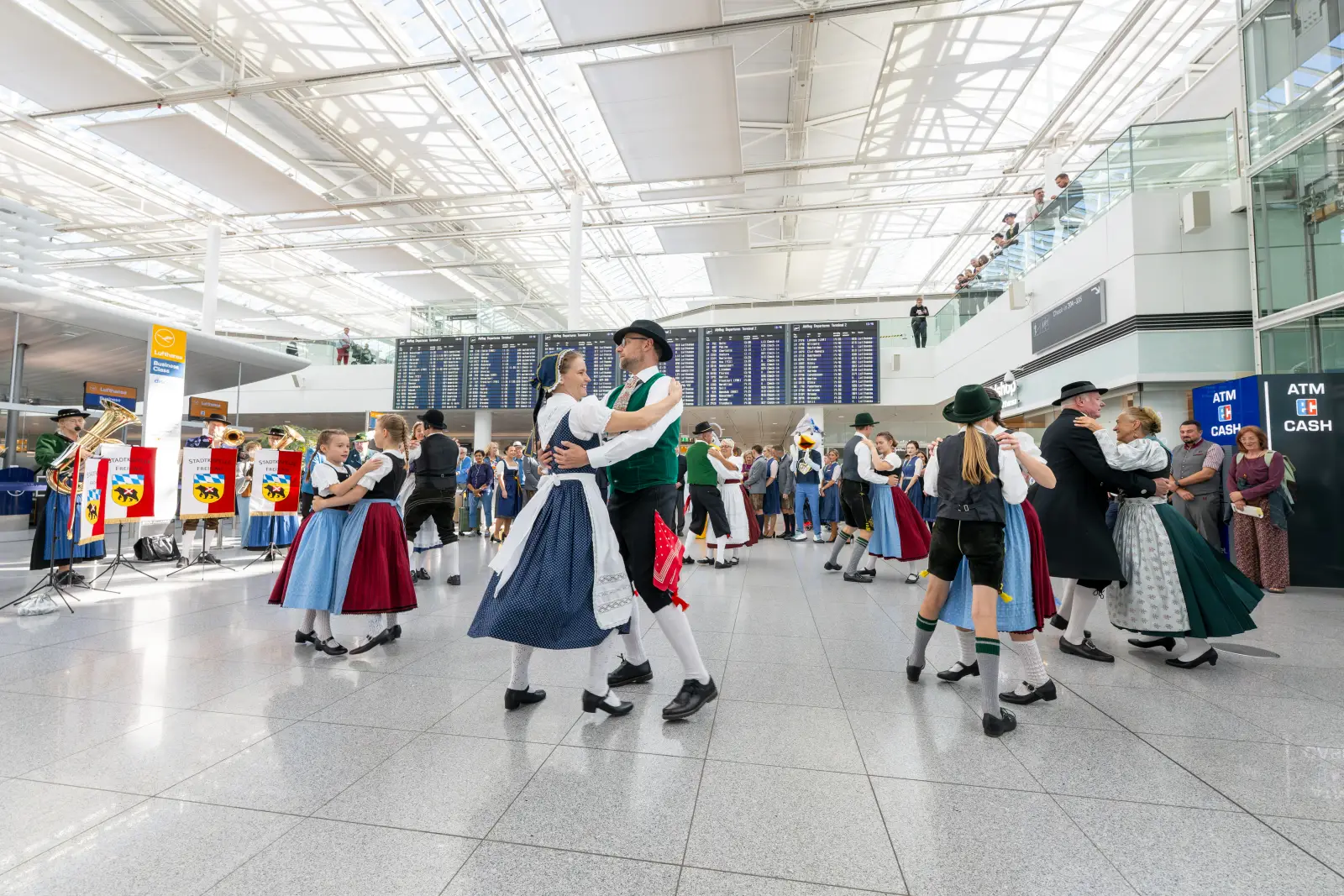 Traditional Bavarian dancers perform in Munich Airport Terminal 2 to mark the start of Oktoberfest celebrations.