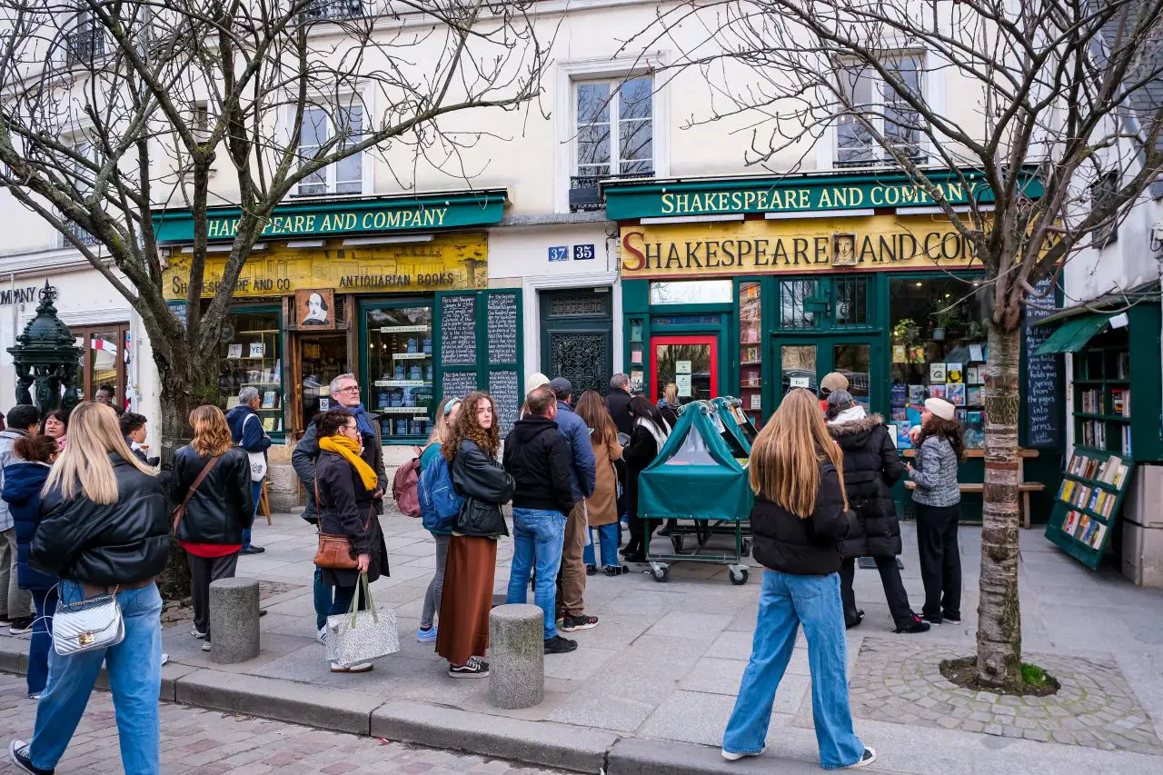 Tourists gathered outside Shakespeare and Company bookstore in Paris, a literary landmark once visited by Hemingway, Pound, Fitzgerald, Stein, and Joyce