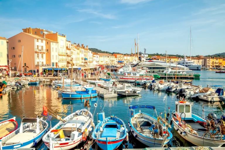 Luxury Travel 29 Harbour of Saint Tropez on the Côte d’Azur, France, with colorful boats and pastel waterfront buildings.