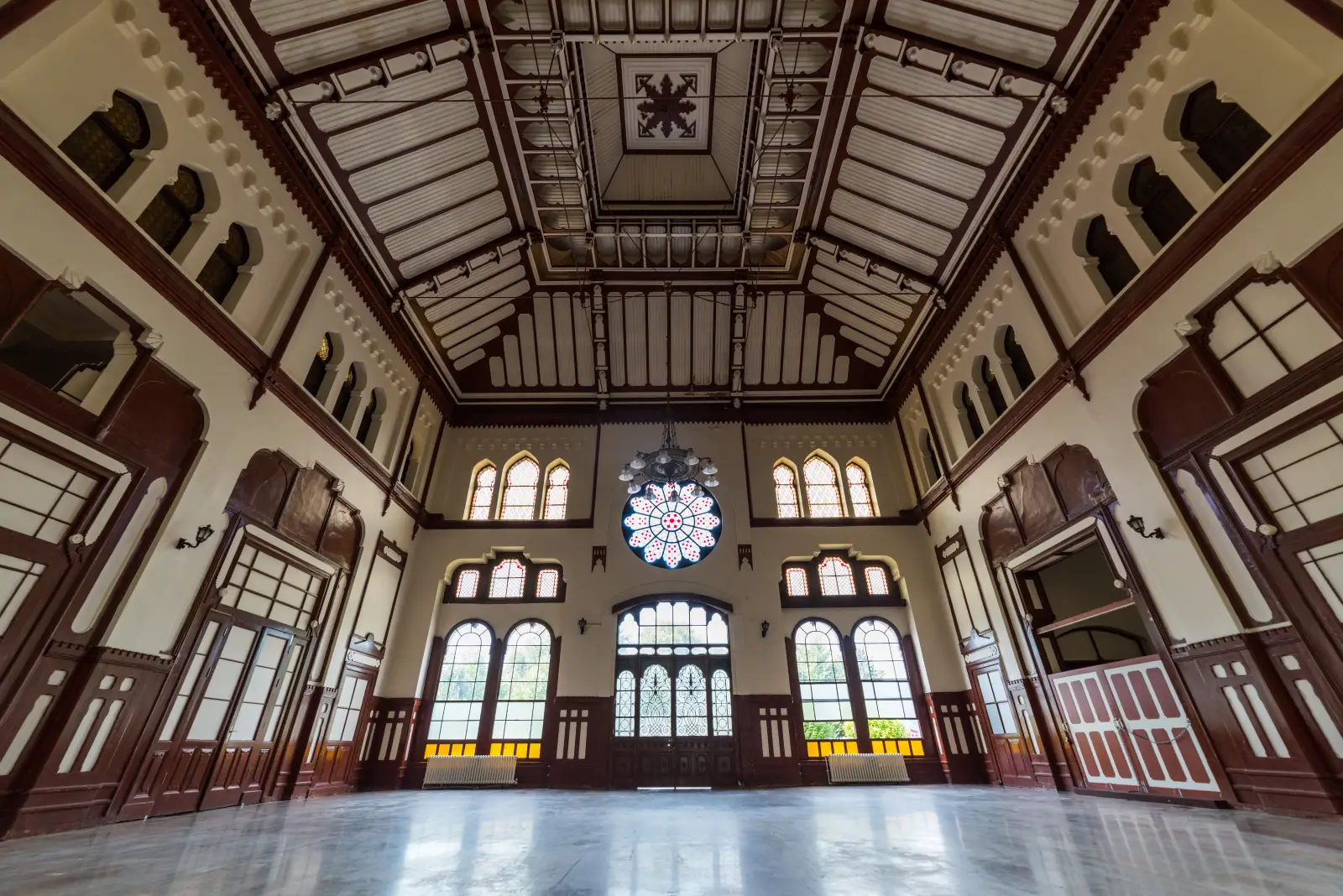 Historic Sirkeci Train Station In Istanbul To Reopen As Cultural Hub In 2026 2 Interior hall of historic Sirkeci railway station in Istanbul with stained glass windows, wooden details, and high ornate ceiling.