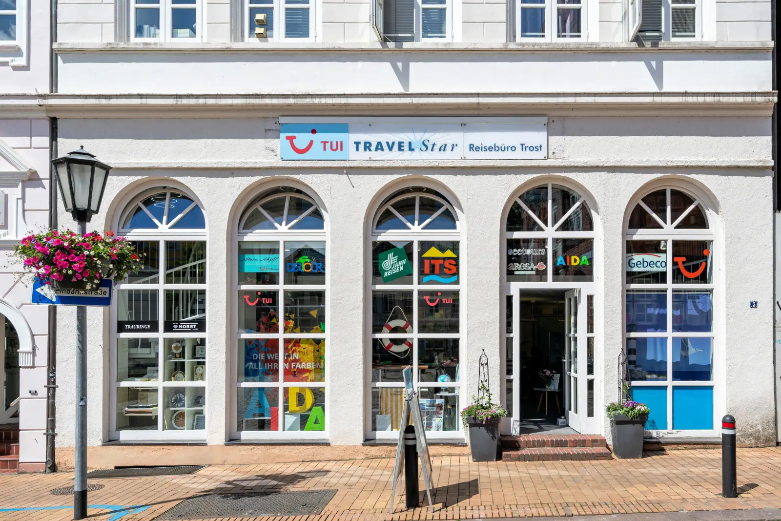 TUI Travel Star agency storefront with travel logos in Rendsburg, Germany
