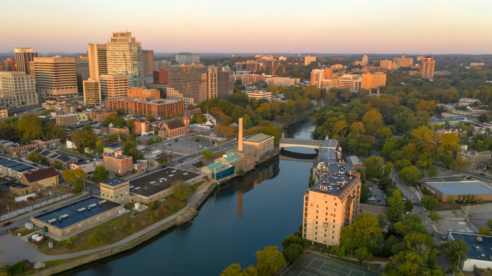 Aerial view of downtown Wilmington Delaware with buildings and river in morning light