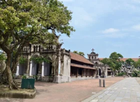 Vietnam’s Stone Cathedral – A Masterpiece Of Stone And Faith 12 8c. Side view of church 2