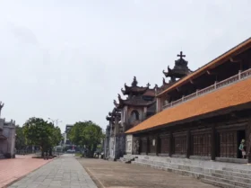 Vietnam’s Stone Cathedral – A Masterpiece Of Stone And Faith 13 8d. Side view of church with roof tiles
