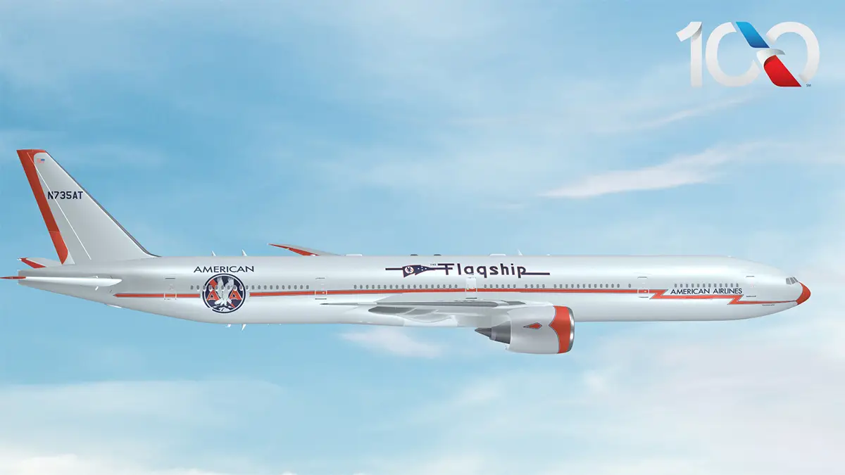 American Airlines Boeing 777-300 in special centennial Flagship livery featuring retro orange lightning bolt and classic eagle roundel.