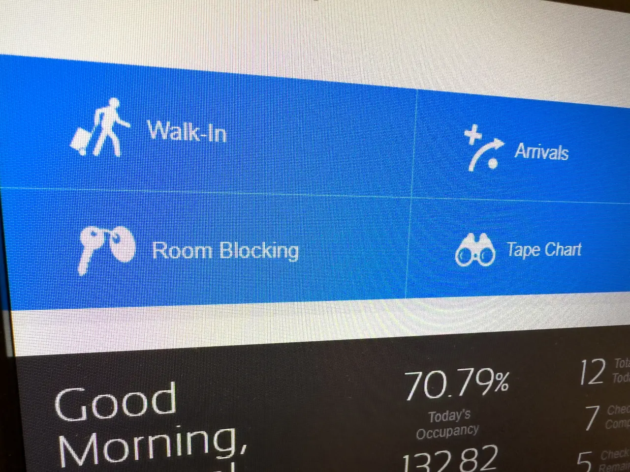 Weather, Events, And Algorithms: The Hidden Factors Behind Smart Hotel Pricing 2 Hotel management software screen showing options for walk-ins, arrivals, room blocking, and tape chart with occupancy data.