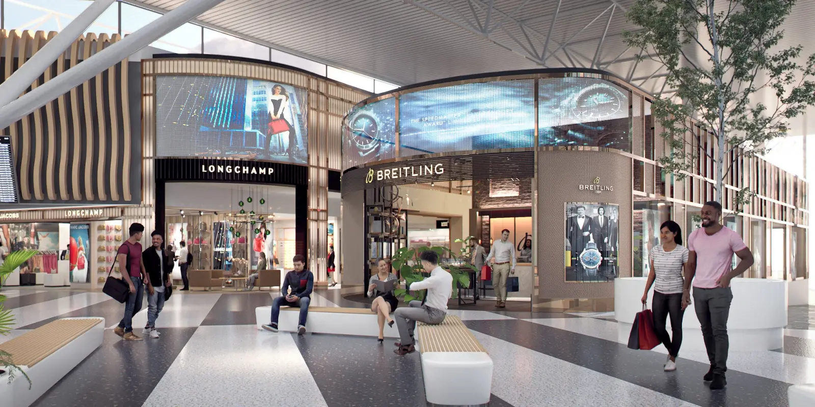 Travelers walk through JFK Terminal 8’s modern retail area featuring Longchamp and Breitling boutiques.
