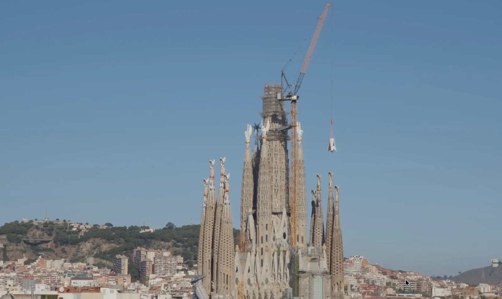 Sagrada Família Installs First Element Of Tower Of Jesus Cross 2 A crane lifts the first element of the Tower of Jesus cross above the Sagrada Família in Barcelona.