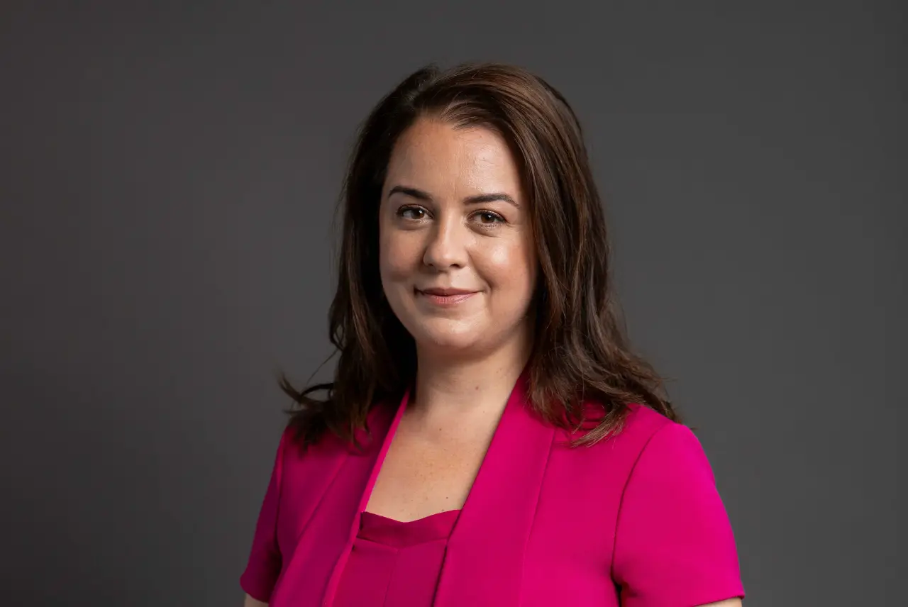New UK Tourism Minister to Make First Major Appearance at WTM London 2025 15 Portrait of Stephanie Peacock, UK Minister for Sport, Tourism, Civil Society and Youth in a bright pink jacket against a gray background.