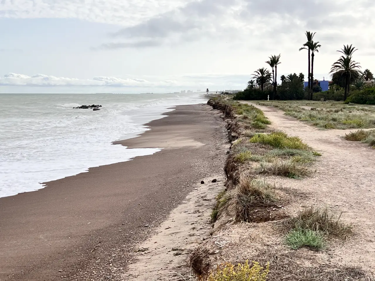 Thousands Flee Floods In Spain As Storm Alice Turns Roads Into Waterways 3 Eroded beach and shoreline after Storm Alice waves in Valencia, Spain.