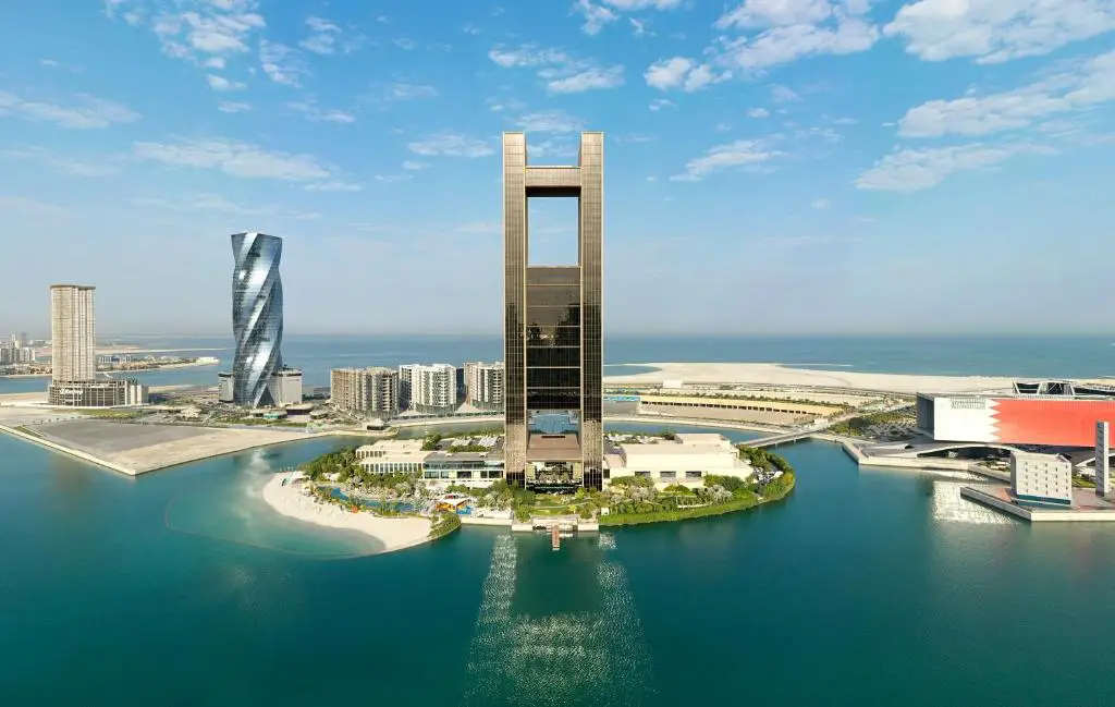 Why Winter Is The Best Time To Visit Bahrain: Weather, Activities, And Top Experiences 4 Aerial view of the Four Seasons Hotel Bahrain Bay surrounded by turquoise water and modern Manama skyline.