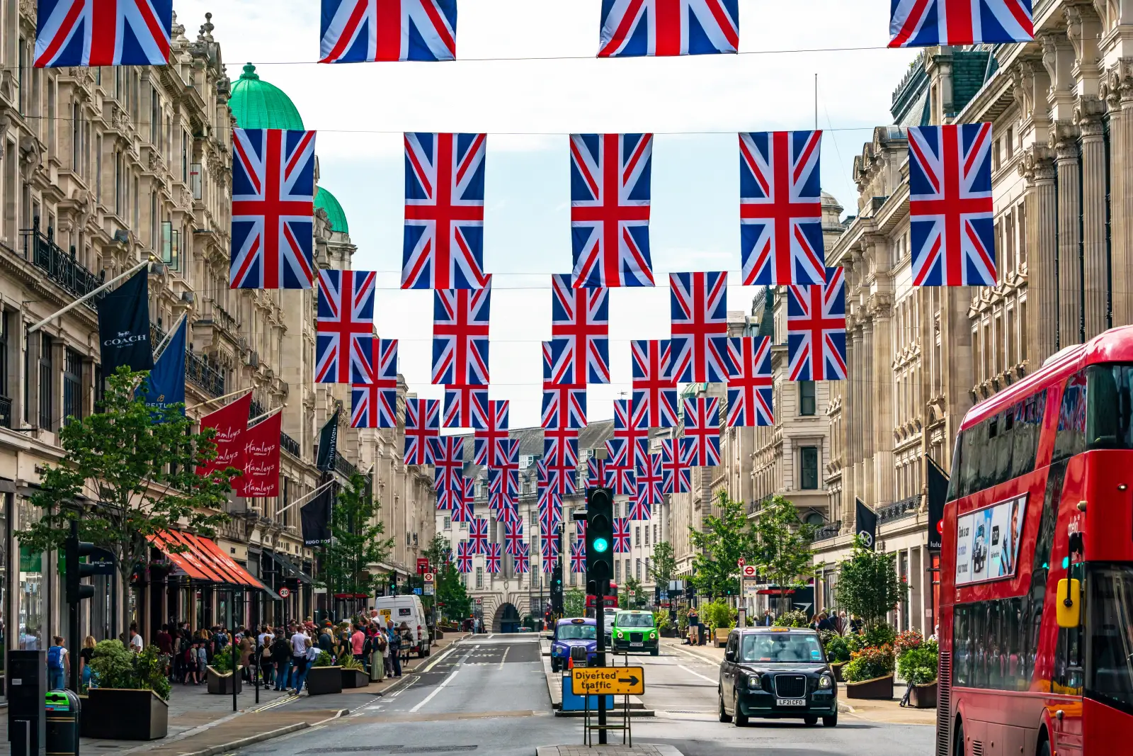 Rows of Union Jack flags hanging above Regent Street in London, UK.
