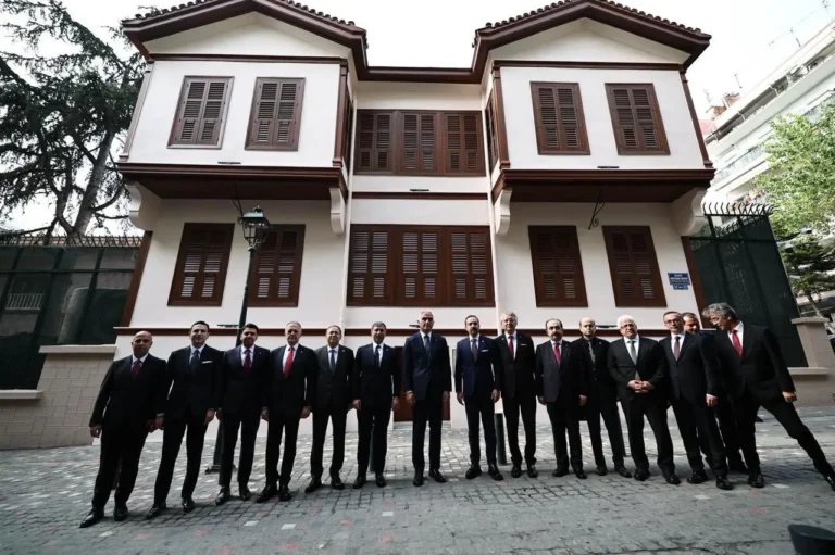 Turkish delegation stands in front of the restored Ataturk House in Thessaloniki, Greece.