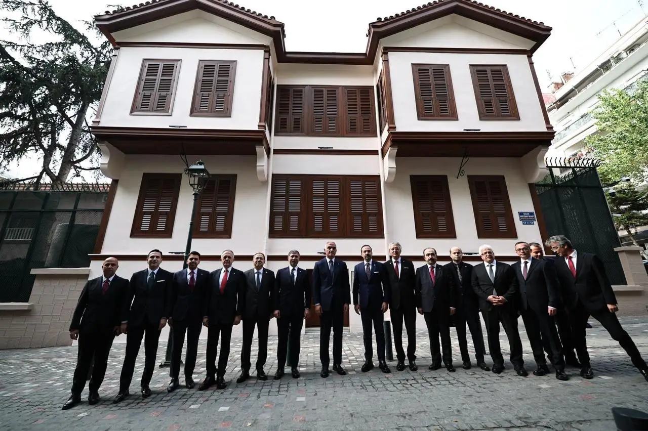 Turkish delegation stands in front of the restored Ataturk House in Thessaloniki, Greece.