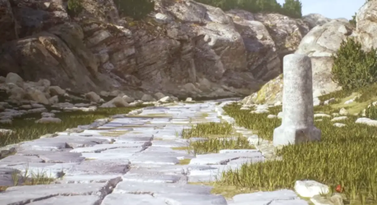 Ancient Roman stone-paved road curving through rocky terrain with a milestone marker.