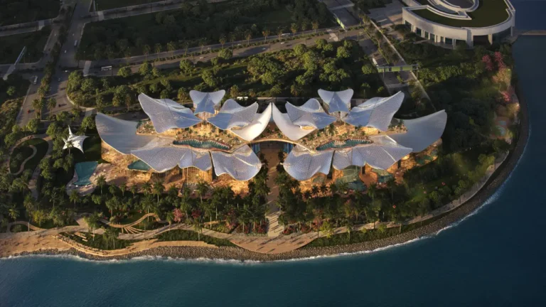 Aerial render of Therme Singapore showing its futuristic coastal architecture and landscaped waterfront design.