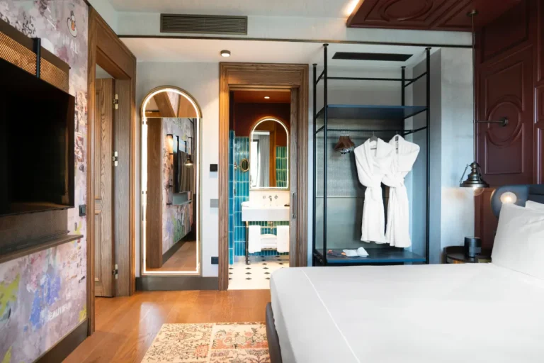 News From Turkey - Türkiye 28 Modern guest room at Canopy by Hilton Istanbul Taksim with open wardrobe and bathroom view