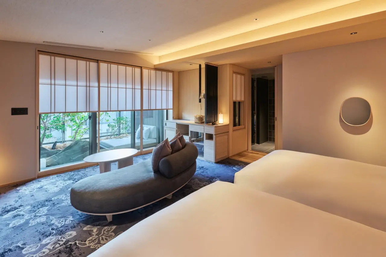 Japan'S Most Michelin Key-Awarded Resort Brand, Fufu, Opens Its First Tokyo Property 3 Elegant guest bedroom at FUFU Tokyo Ginza with twin beds, garden view, and soft ambient lighting