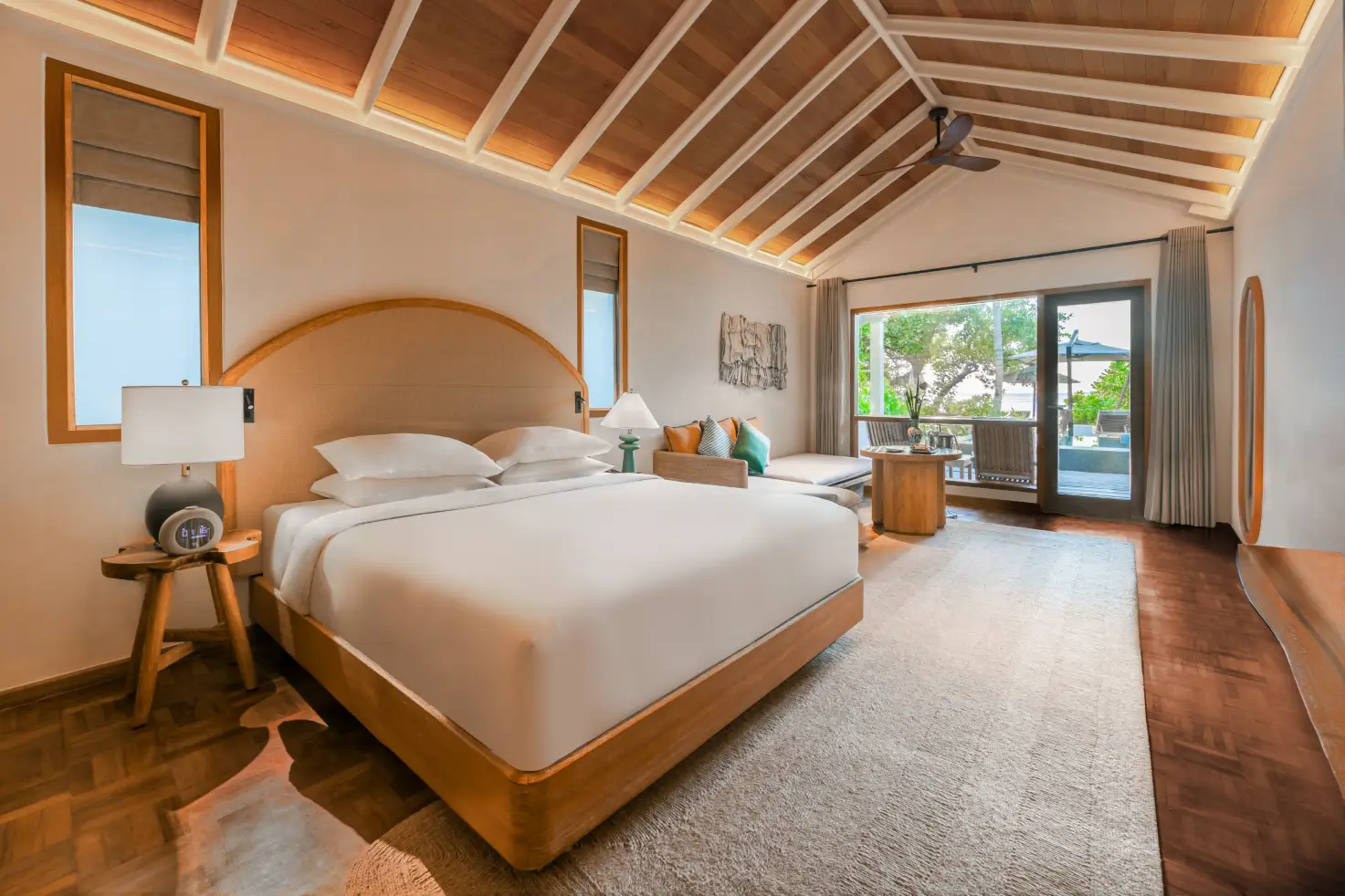 Nh Collection Maldives Reethi Resort Debuts After Major Renovations 3 Interior of a deluxe sunset villa with pool at NH Collection Maldives Reethi Resort, featuring a king bed and terrace view.