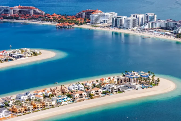 Other News 6 Aerial view of luxury villas and resorts on Palm Jumeirah with turquoise sea and sandy beaches.