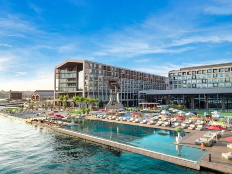 News From Turkey - Türkiye 25 Waterfront hotel complex at Tersane Istanbul with outdoor pool, sun loungers and modern buildings overlooking the Golden Horn.