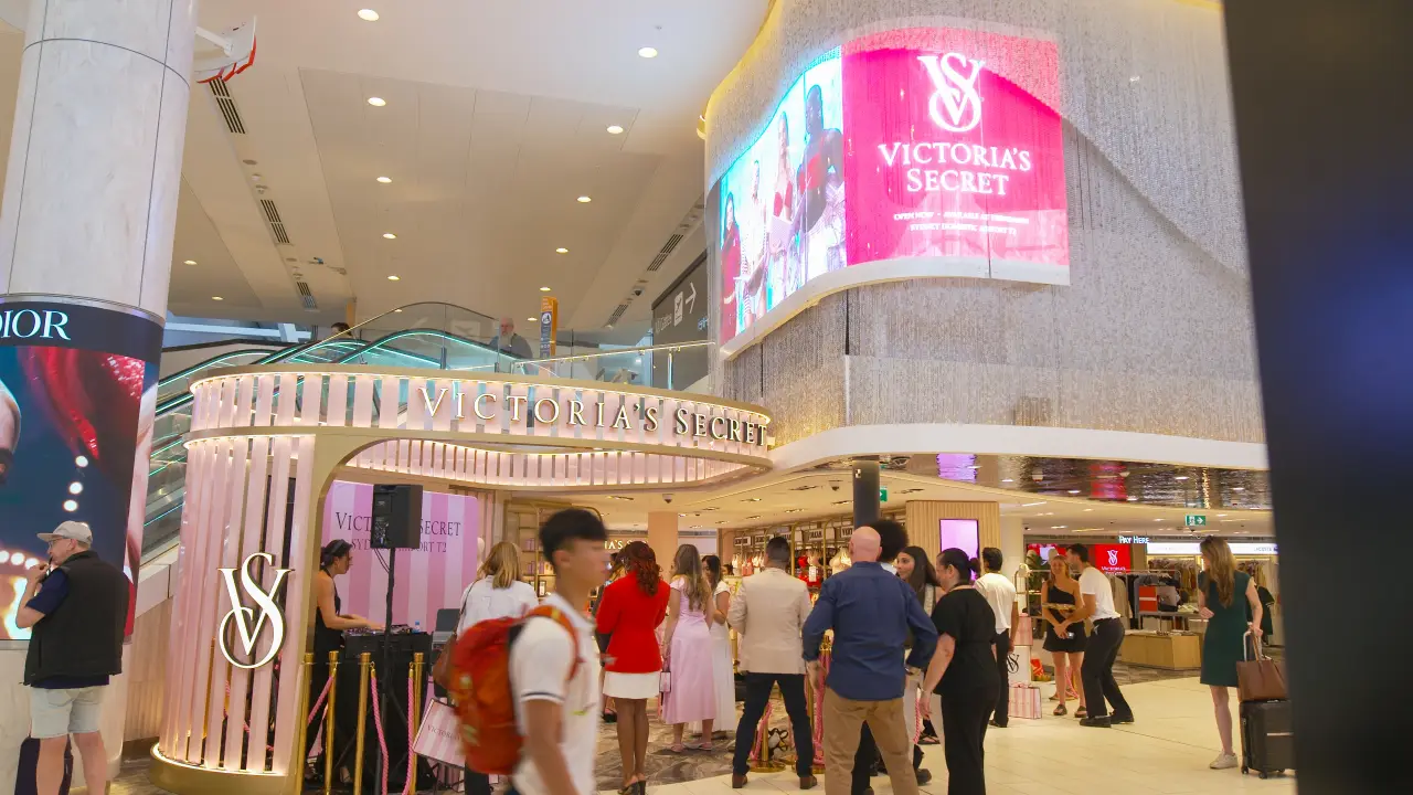 Passengers gather outside the Victoria’s Secret boutique at Sydney Airport Terminal 2
