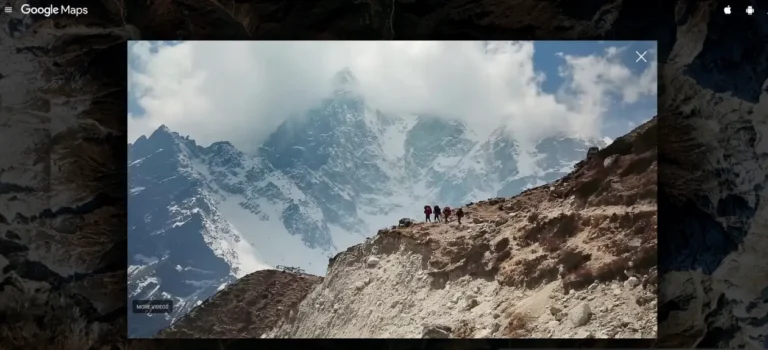 Technology 19 Trekkers walking along a rocky trail in Nepal’s Khumbu region with snow-covered Himalayan peaks in the background.