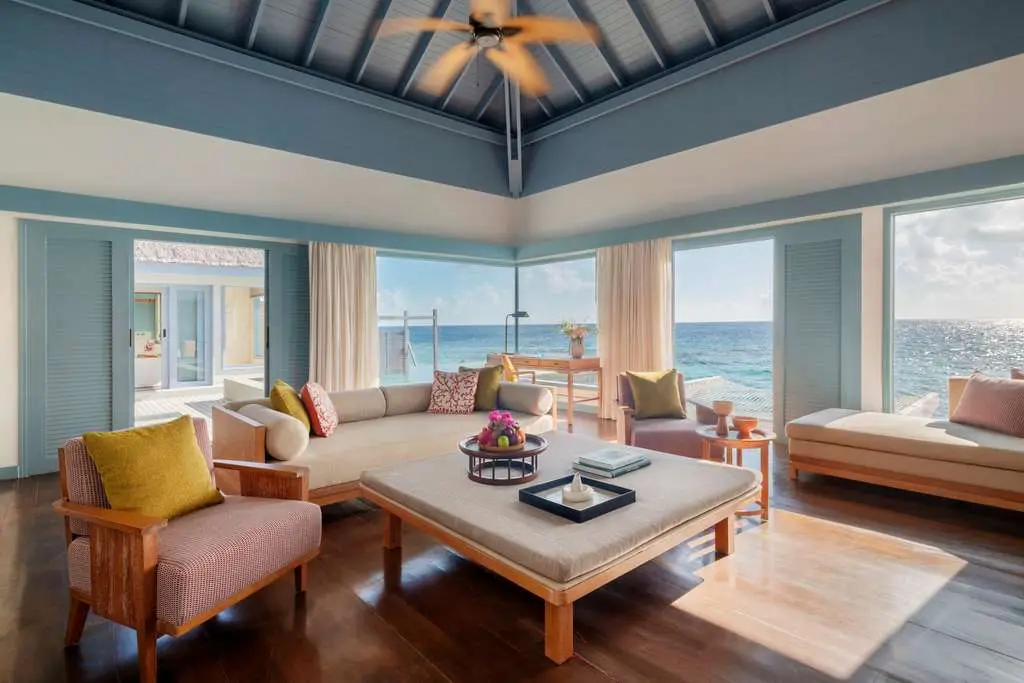 New Maldives Hotels &Amp; Resorts, 2025 &Amp; 2026 15 Oceanfront villa living room with open-plan seating, natural wood furnishings, and panoramic sea views at The Halcyon Private Isles Maldives.