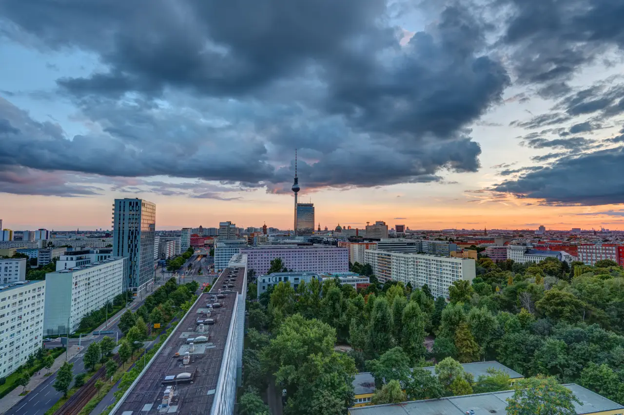Berlin city skyline with the TV Tower under dark clouds during a power outage