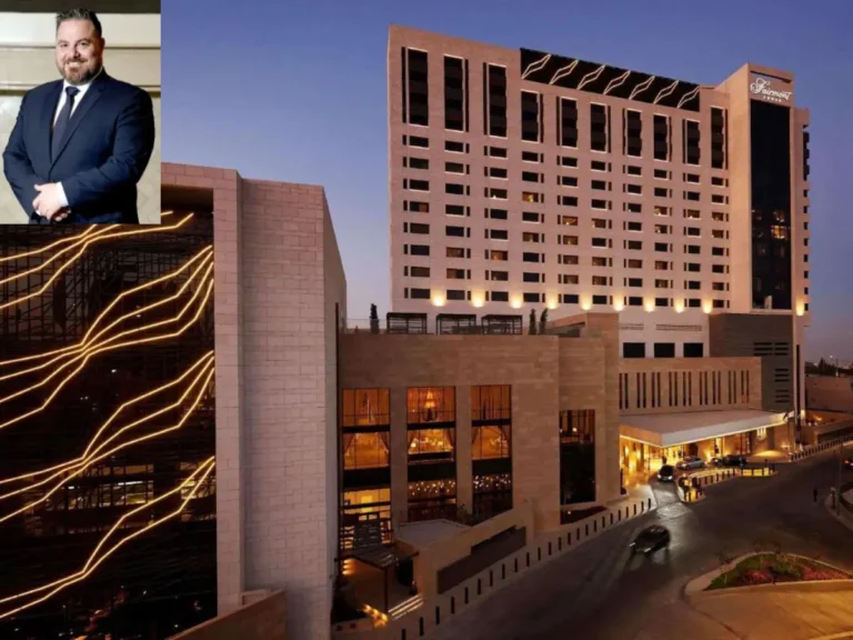 Fairmont Amman hotel exterior at dusk, with an inset portrait of Nikolaos Kaloudis, the hotel’s newly appointed General Manager.